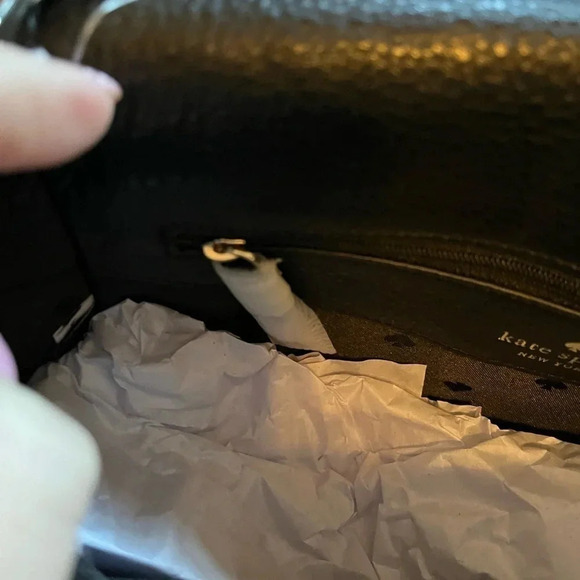 This is a NWT Kate Spade purse in black pebble leather with gold furnishings. - Picture 8 of 9